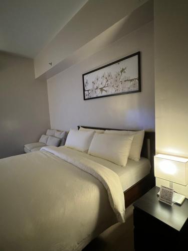 81 Newport Blvd Cluster 5 Unit 3F by Rechelle Nunagにあるベッド