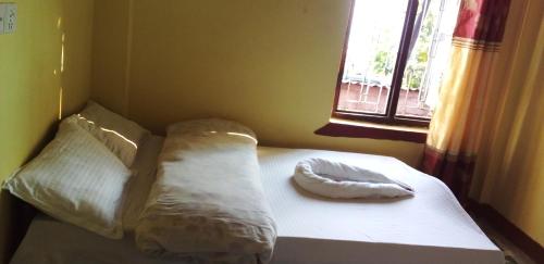 Postel nebo postele na pokoji v ubytování Gaurav Homestay