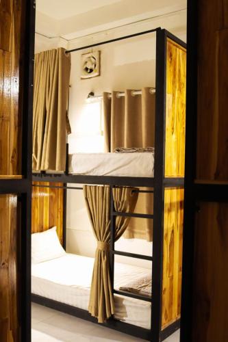 Postel nebo postele na pokoji v ubytování SaBai Backpacker Hostel