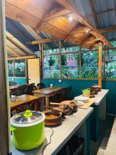 a table with food on it in a restaurant at Alass Ga For Pets Lovers in Trincomalee