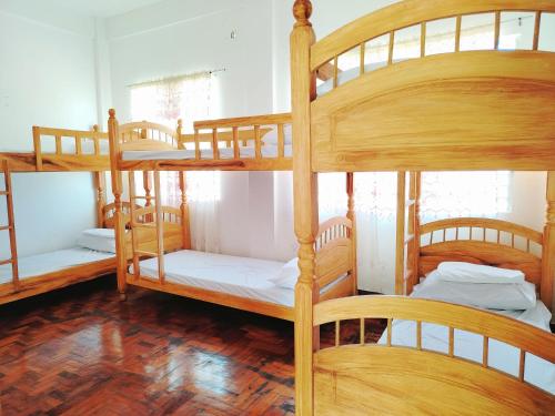 a group of bunk beds in a room at RKC Guest House in Coron