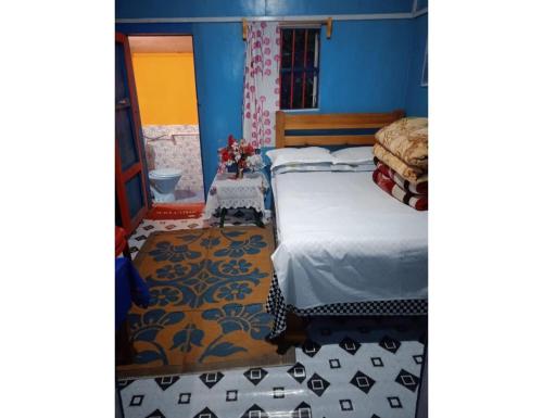 Postel nebo postele na pokoji v ubytování Siddharth Home Stay, Dawaipani