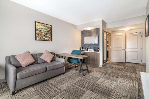 a living room with a couch and a table at Hilton Garden Inn Albany-SUNY Area in Albany