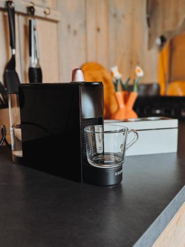 a coffee maker sitting on top of a counter at Glamping Holten luxe safaritent 1 in Holten