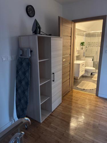 a tie sitting on top of a cabinet in a bathroom at Oaza Spokoju in Augustów