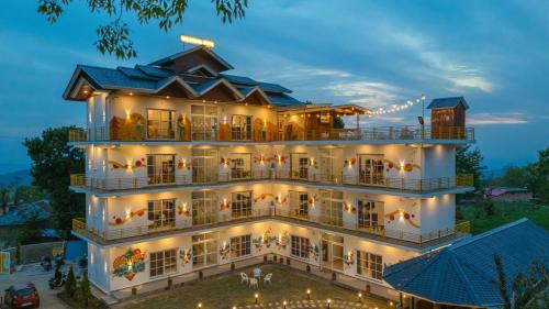 an aerial view of a hotel at night at The Social Stays Bir formerly ArtBuzz in Bīr