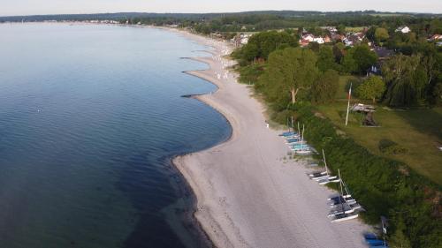 an aerial view of a beach with boats at Flipper in Sierksdorf