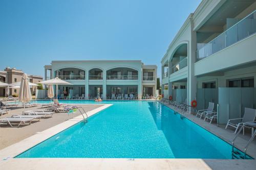 a large swimming pool next to a building at Blue Lagoon Queen in Kalyves Poligirou