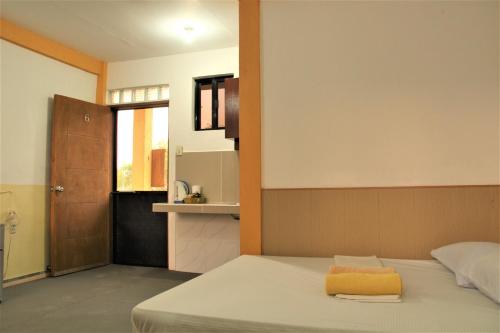 Postel nebo postele na pokoji v ubytování Good Guys Beach Resort