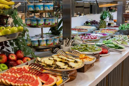 a buffet line with many different types of food at Mukarnas Pera Hotel in Istanbul
