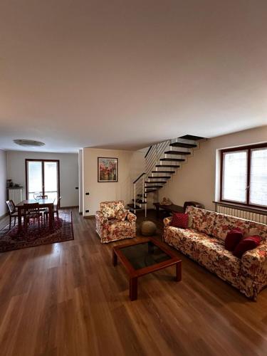 a living room with a couch and a table at Civico60 in Solbiate Arno