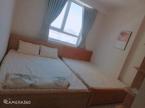 Una cama o camas en una habitación de DINO Home HACOM 2BR 2WC