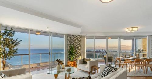 a living room with a view of the ocean at Cooly Bliss Sub-penthouse in Gold Coast