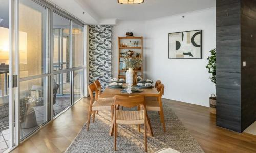 a dining room with a table and chairs at Cooly Bliss Sub-penthouse in Gold Coast