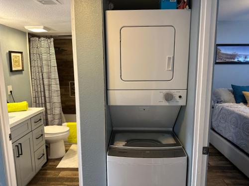 a washer and dryer in a small bathroom at Casada in Las Vegas