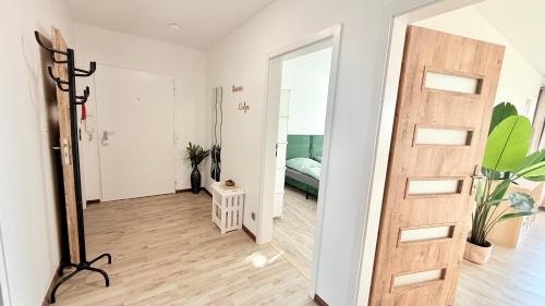 a hallway with a door and a mirror at Panorama Lodge in Salzgitter