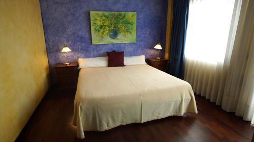 Posteľ alebo postele v izbe v ubytovaní Hotel Tikar