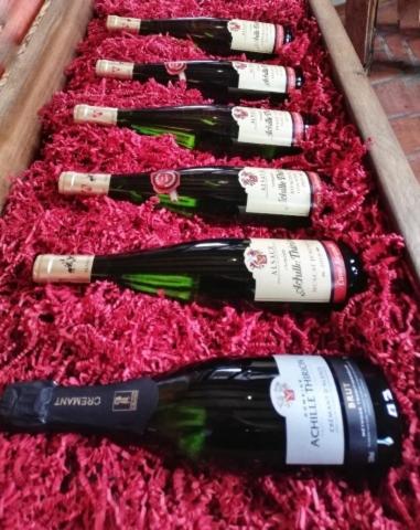 a bunch of bottles of wine in a box at Gîtes Thirion in Saint-Hippolyte