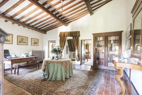 a living room with a table and a piano at Villas Angiolina in Višnjan