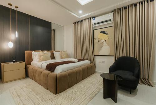 Postel nebo postele na pokoji v ubytování George Residence Kaura Abuja