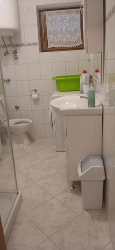 a bathroom with a toilet and a sink at Kelk Loznati in Loznati