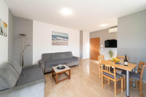 a living room with a couch and a table at Apartment Thomas in Novigrad Istria
