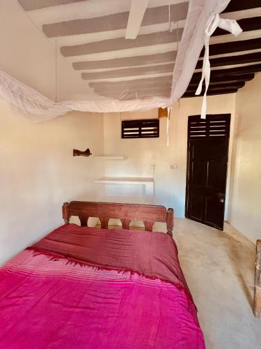 Ein Bett oder Betten in einem Zimmer der Unterkunft Banana Shamba Estate