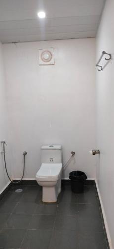 a bathroom with a white toilet in a room at Serene Beach Agonda in Canacona