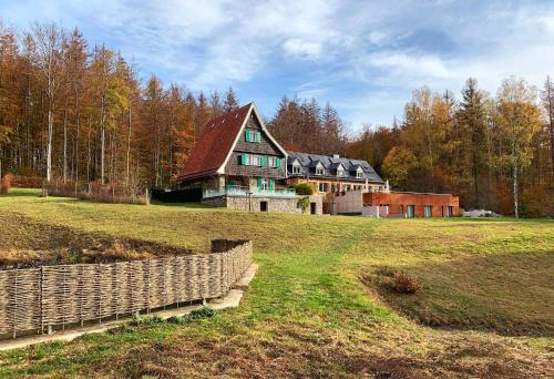 a large house sitting on top of a field at Jagdschloss Windenhütte in Thale