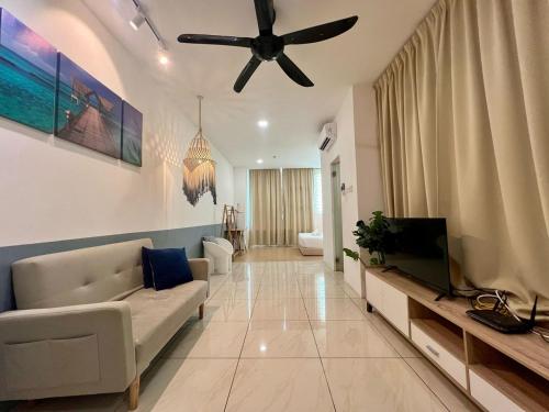 a living room with a couch and a ceiling fan at ITCC Manhattan by IGVC in Penampang