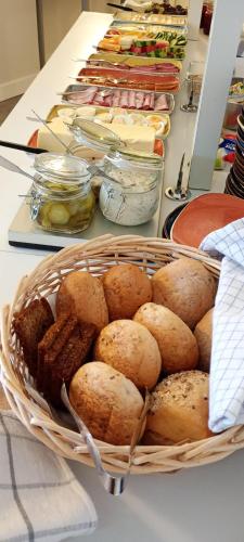 a basket of food on a counter with other foods at Hotel Charlotte / Stella in Uppsala