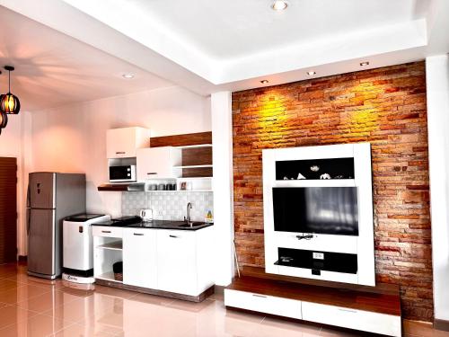 Kuchyň nebo kuchyňský kout v ubytování Sivana Place Phuket