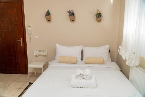 Ένα ή περισσότερα κρεβάτια σε δωμάτιο στο Stergios_Apartments 01