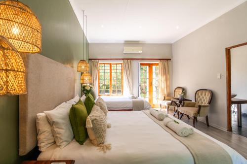 Ένα ή περισσότερα κρεβάτια σε δωμάτιο στο Thorntree Country Lodge