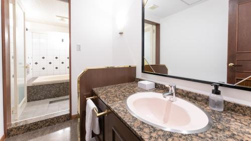 Ein Badezimmer in der Unterkunft Tabist Shizukuishi Resort Hotel