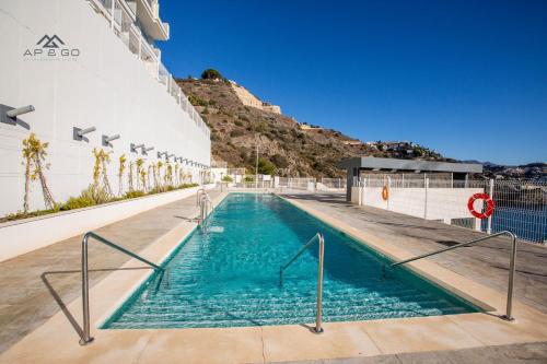 a swimming pool on the side of a cruise ship at Icon Luxury Seaview Marina in Almuñécar