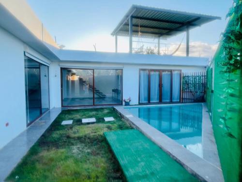 a swimming pool in the middle of a house at Villa Bella with private pool and high speed internet in Puerto Villamil