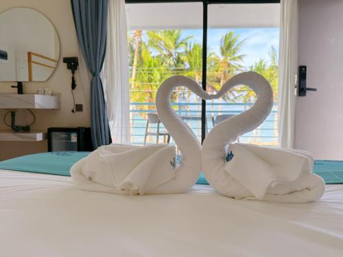 Łóżko lub łóżka w pokoju w obiekcie LuckyTito Divers Resort Boracay Island