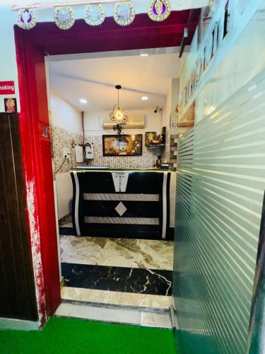 a view through a door into a room with a table at Hotel O The Moon in New Delhi