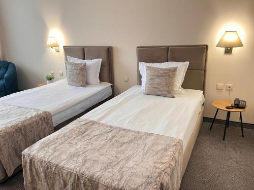 Ένα ή περισσότερα κρεβάτια σε δωμάτιο στο Hotel Orbita