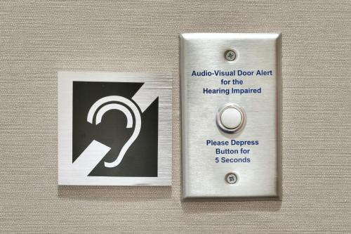 a metal doorhandle with a sign that readsaicweapon door art for the healing at Fairfield by Marriott Inn & Suites Houston League City in League City