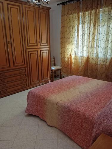 Un pat sau paturi într-o cameră la Casa Vacanze Anna