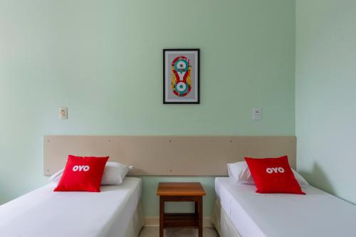 Postel nebo postele na pokoji v ubytování OYO Hotel Cosmópolis, Sao Paulo