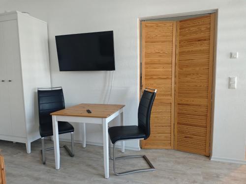 Μια τηλεόραση ή/και κέντρο ψυχαγωγίας στο Apartment in Landsberg, Erpfting