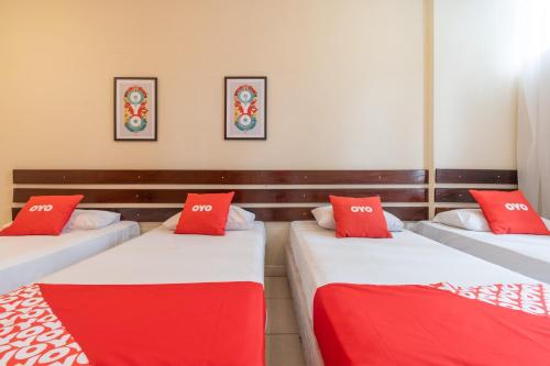 Un ou plusieurs lits dans un hébergement de l'établissement OYO Hotel L'Espace - Jaraguá Belo Horizonte