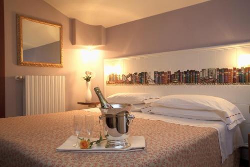 Ένα ή περισσότερα κρεβάτια σε δωμάτιο στο Hotel Alexandra