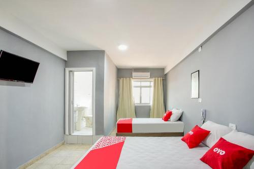Postel nebo postele na pokoji v ubytování OYO Hotel Boneville, São Paulo