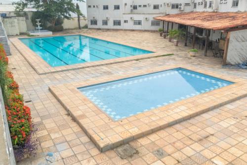 an overhead view of a swimming pool on a patio at OYO New Anápolis Hotel, Imperatriz in Imperatriz