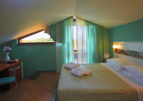Postel nebo postele na pokoji v ubytování Hotel Alexandra