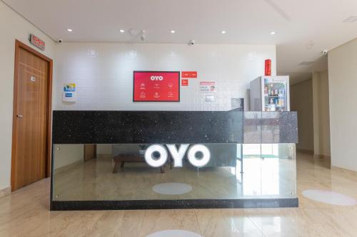 an ovo store in a building with a sign on it at OYO Tropical Confort Hotel, Brasilia in Brasilia